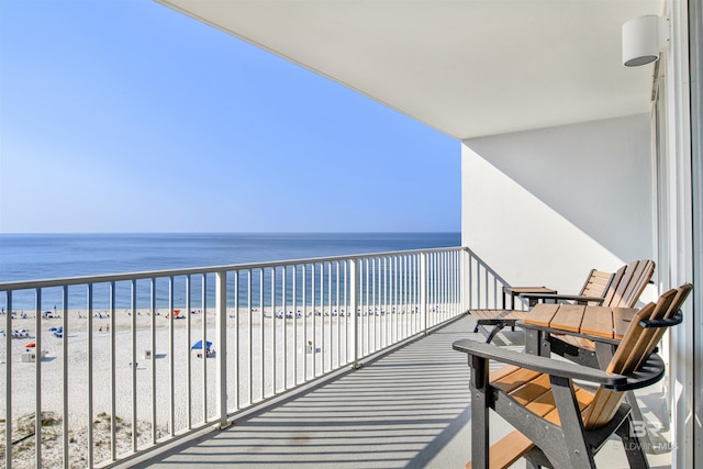 balcony with a beach view and a water view