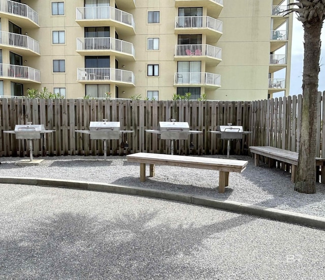 view of property's community with fence