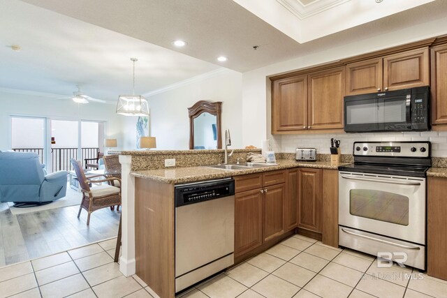 401 E Beach Blvd Unit 1302, Gulf Shores, AL 36542 - kitchen featuring light tile patterned floors, a peninsula, crown molding, stainless steel appliances, and a sink