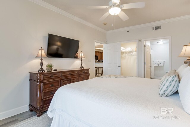 401 E Beach Blvd Unit 1302, Gulf Shores, AL 36542 - bedroom with baseboards, ornamental molding, ensuite bathroom, visible vents, and ceiling fan