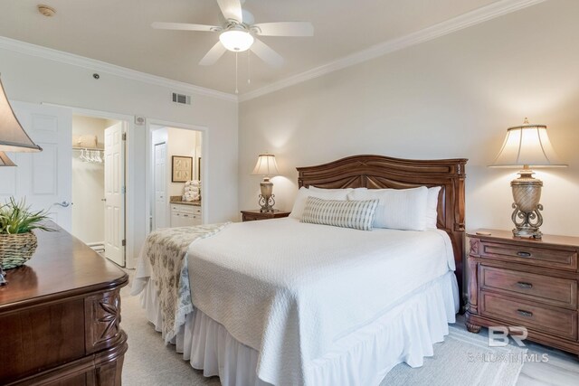 401 E Beach Blvd Unit 1302, Gulf Shores, AL 36542 - bedroom with visible vents, a closet, crown molding, a walk in closet, and ensuite bath