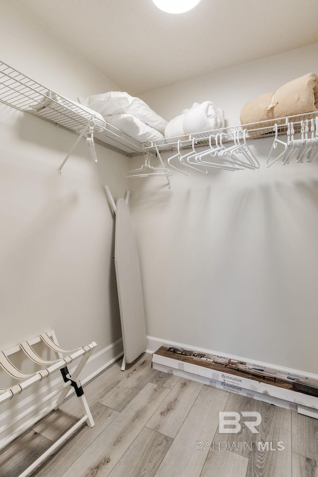 401 E Beach Blvd Unit 1302, Gulf Shores, AL 36542 - walk in closet featuring light wood-style floors