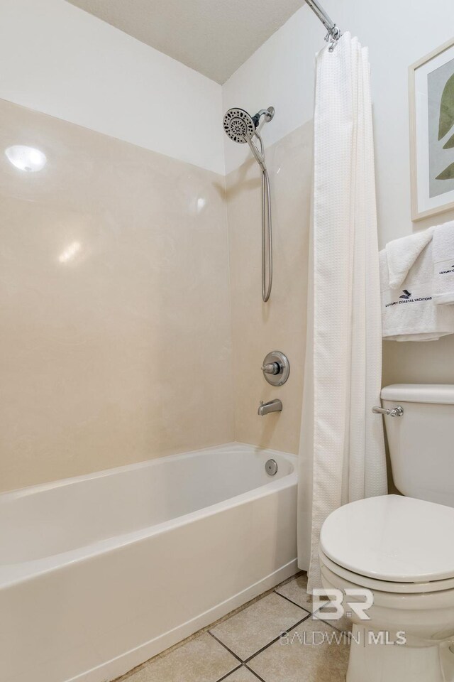 401 E Beach Blvd Unit 1302, Gulf Shores, AL 36542 - bathroom with toilet, shower / bath combination with curtain, and tile patterned flooring