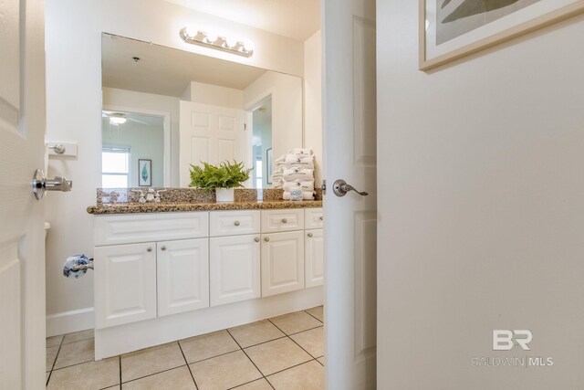 401 E Beach Blvd Unit 1302, Gulf Shores, AL 36542 - bathroom featuring tile patterned floors, vanity, and a ceiling fan