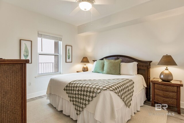 401 E Beach Blvd Unit 1302, Gulf Shores, AL 36542 - bedroom with ceiling fan, light wood finished floors, and baseboards