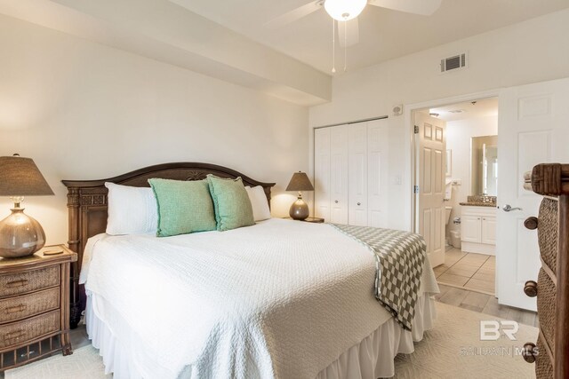 401 E Beach Blvd Unit 1302, Gulf Shores, AL 36542 - bedroom with visible vents, a closet, connected bathroom, and ceiling fan
