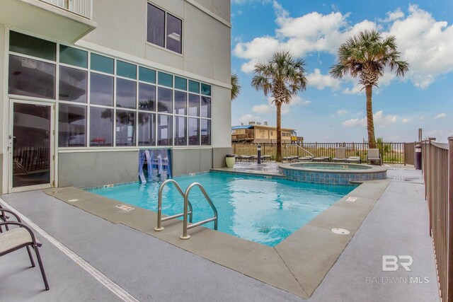 401 E Beach Blvd Unit 1302, Gulf Shores, AL 36542 - community pool featuring fence, a patio, and a hot tub