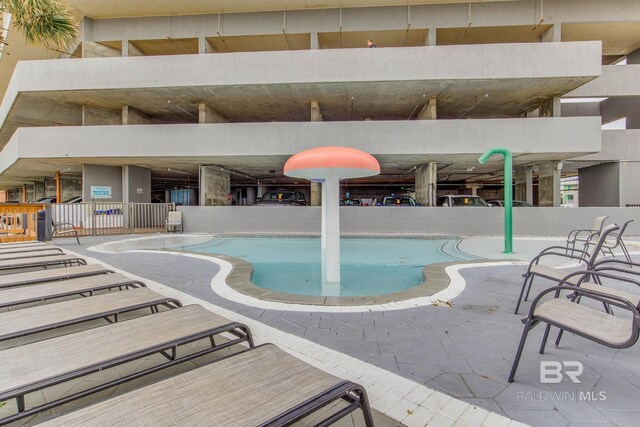 401 E Beach Blvd Unit 1302, Gulf Shores, AL 36542 - view of swimming pool with a patio area