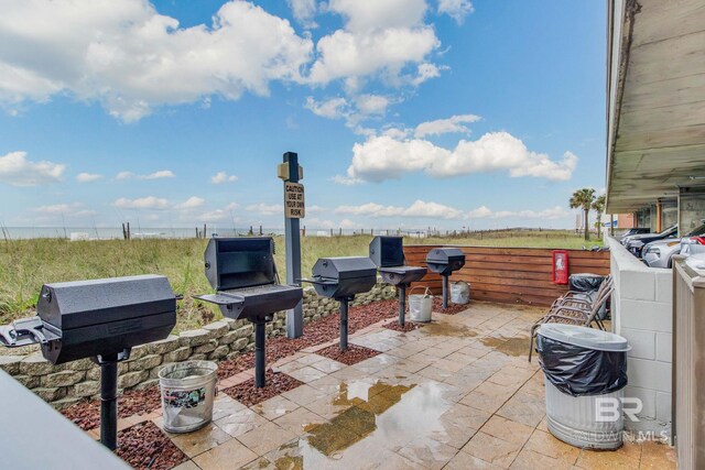 401 E Beach Blvd Unit 1302, Gulf Shores, AL 36542 - view of patio / terrace with fence and area for grilling