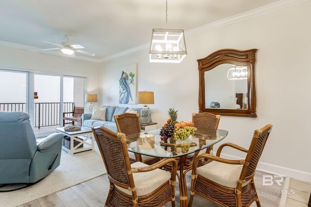 401 E Beach Blvd Unit 1302, Gulf Shores, AL 36542 - dining room with baseboards, ornamental molding, a ceiling fan, and wood finished floors