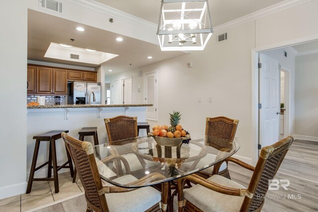 401 E Beach Blvd Unit 1302, Gulf Shores, AL 36542 - dining area with ornamental molding, visible vents, light wood-type flooring, and recessed lighting