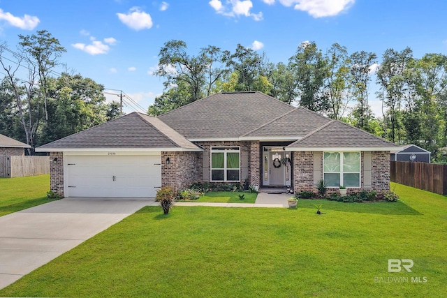 23038 Ridgewood Dr, Robertsdale, AL 36567 - view of front of home with brick siding, an attached garage, and roof with shingles