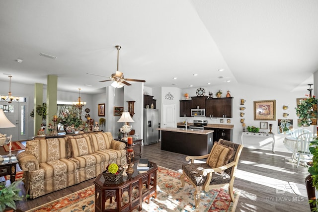 23038 Ridgewood Dr, Robertsdale, AL 36567 - living room featuring a chandelier, vaulted ceiling, dark wood-style floors, a ceiling fan, and recessed lighting