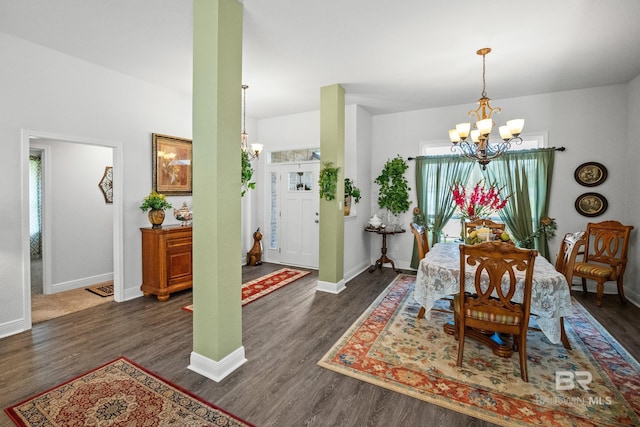 23038 Ridgewood Dr, Robertsdale, AL 36567 - dining room featuring a chandelier, dark wood finished floors, and baseboards