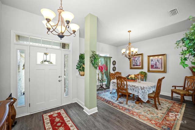 23038 Ridgewood Dr, Robertsdale, AL 36567 - entrance foyer with a chandelier, dark wood-style flooring, baseboards, and plenty of natural light