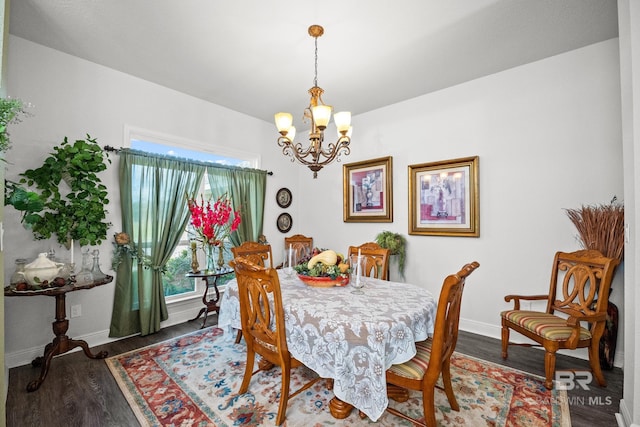 23038 Ridgewood Dr, Robertsdale, AL 36567 - dining space with a chandelier, baseboards, and wood finished floors