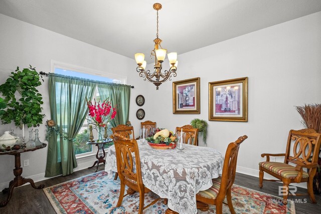 23038 Ridgewood Dr, Robertsdale, AL 36567 - dining area with a chandelier, baseboards, wood finished floors, and plenty of natural light