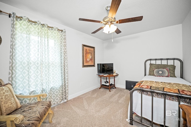 23038 Ridgewood Dr, Robertsdale, AL 36567 - carpeted bedroom featuring baseboards and a ceiling fan