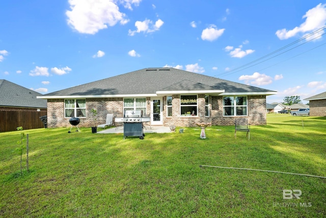 23038 Ridgewood Dr, Robertsdale, AL 36567 - rear view of house featuring brick siding and a patio area
