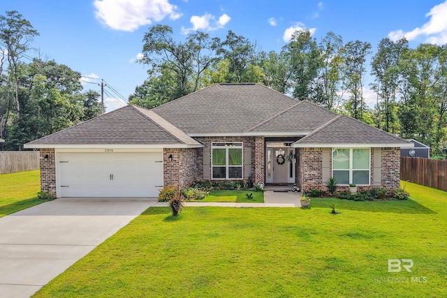 23038 Ridgewood Dr, Robertsdale, AL 36567 - view of front of home featuring brick siding, a garage, a shingled roof, and concrete driveway