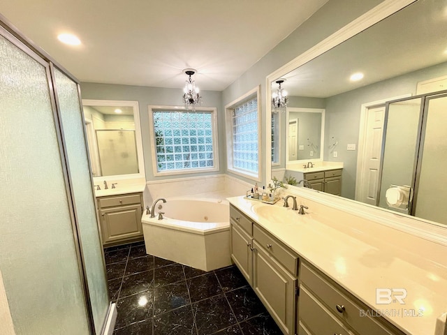 1203 Captain Oneal Dr, Daphne, AL 36526 - full bath featuring a chandelier, a shower stall, two vanities, a whirlpool tub, and recessed lighting