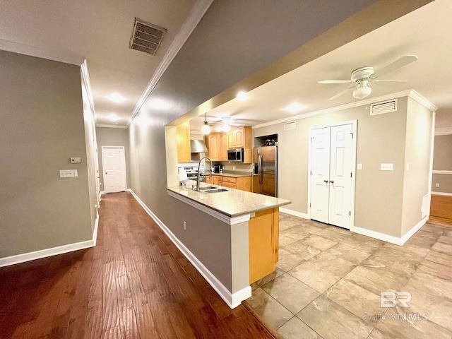 1203 Captain Oneal Dr, Daphne, AL 36526 - kitchen featuring a ceiling fan, stainless steel appliances, light brown cabinets, a sink, and crown molding