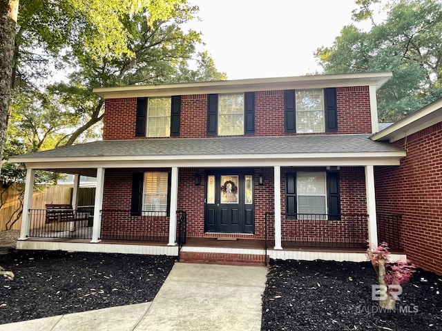 1203 Captain Oneal Dr, Daphne, AL 36526 - view of front of home with covered porch, roof with shingles, and brick siding