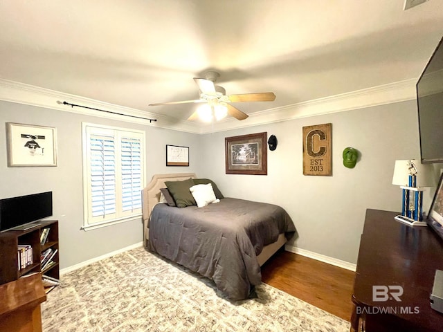 1203 Captain Oneal Dr, Daphne, AL 36526 - bedroom featuring ornamental molding, baseboards, wood finished floors, and a ceiling fan