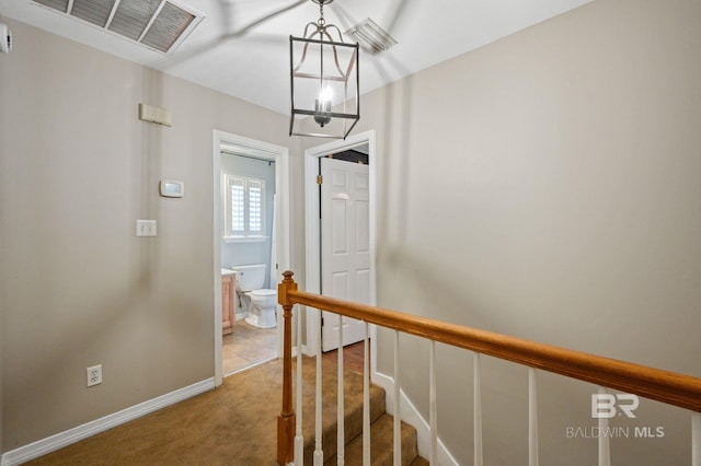 1203 Captain Oneal Dr, Daphne, AL 36526 - hallway featuring a chandelier, light carpet, and baseboards