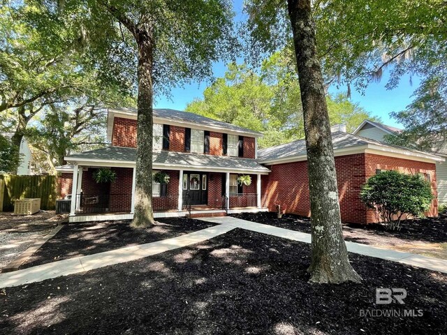 1203 Captain Oneal Dr, Daphne, AL 36526 - view of front of house featuring brick siding, covered porch, and cooling unit