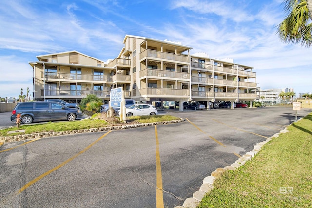 view of property with uncovered parking