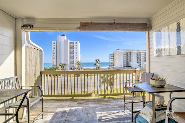 wooden terrace with a water view