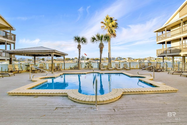 pool with a gazebo and fence