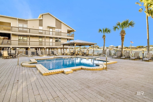 pool with a gazebo and fence