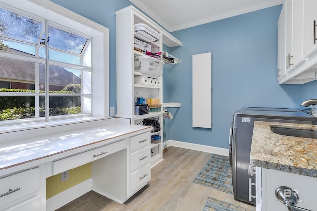 office area with sink, ornamental molding, and light hardwood / wood-style flooring