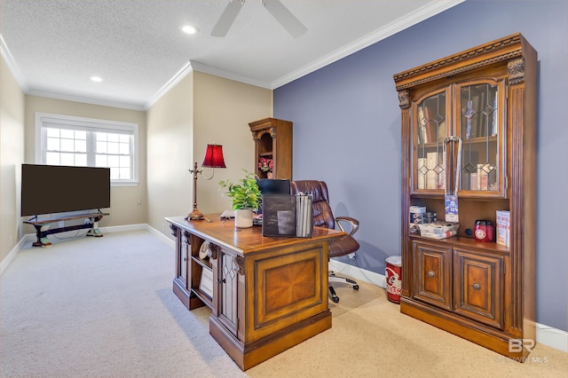 carpeted office space featuring ceiling fan, a textured ceiling, and ornamental molding