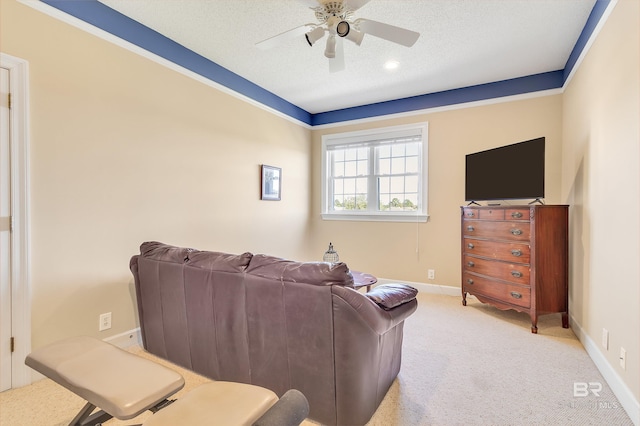 living room featuring light carpet, a textured ceiling, and ceiling fan