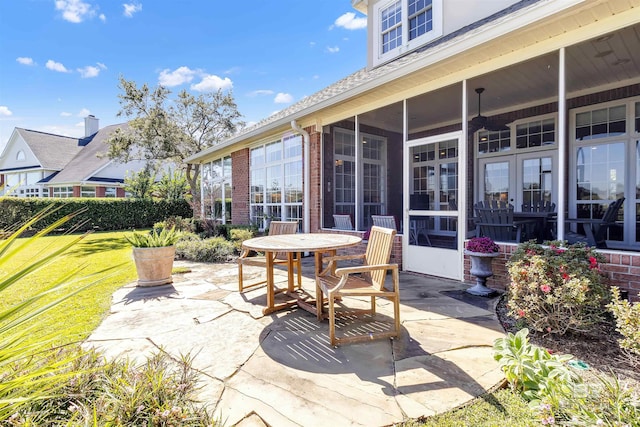 view of patio with a sunroom