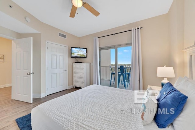 bedroom featuring access to outside, hardwood / wood-style floors, and ceiling fan