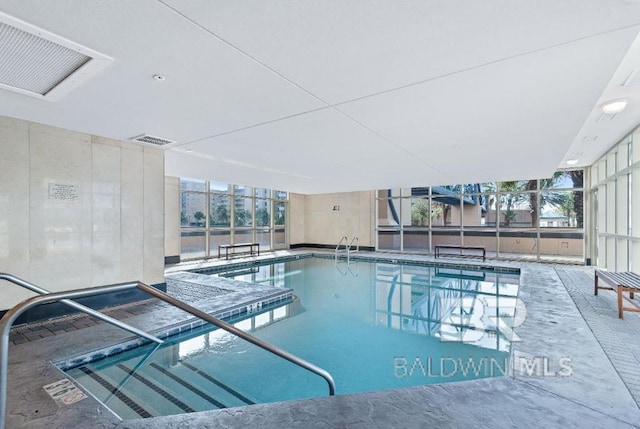 view of pool featuring a patio area and a lanai