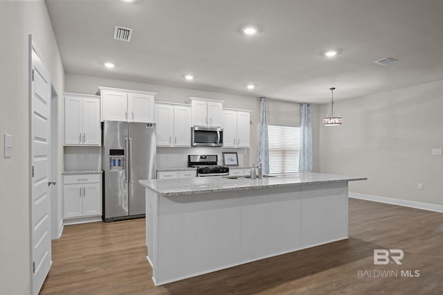 24884 Smarty Jones Cir, Daphne, AL 36526 - kitchen with appliances with stainless steel finishes, white cabinetry, dark wood-style floors, a kitchen island with sink, and recessed lighting