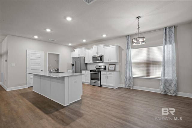 24884 Smarty Jones Cir, Daphne, AL 36526 - kitchen with stainless steel appliances, a center island with sink, white cabinets, dark wood-style flooring, and recessed lighting