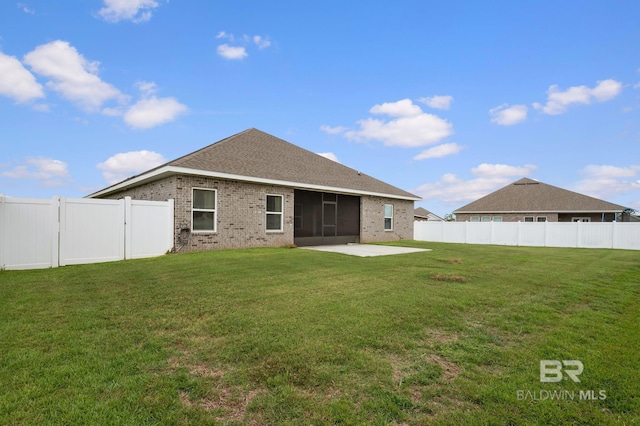 24884 Smarty Jones Cir, Daphne, AL 36526 - back of house with brick siding, a fenced backyard, a patio area, and a sunroom