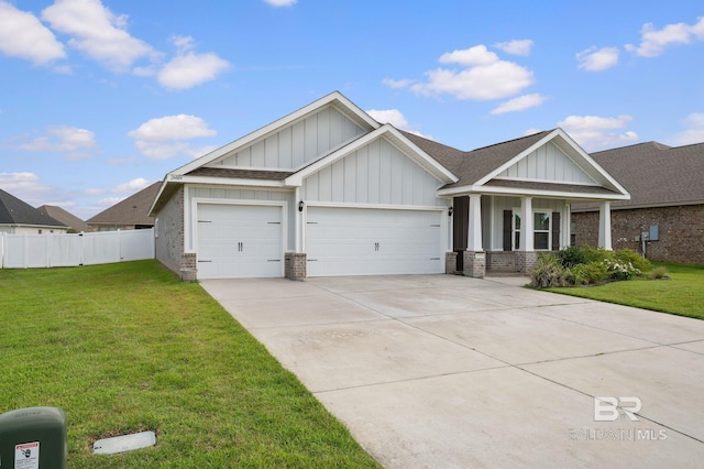 24884 Smarty Jones Cir, Daphne, AL 36526 - craftsman-style home with an attached garage, board and batten siding, brick siding, and driveway