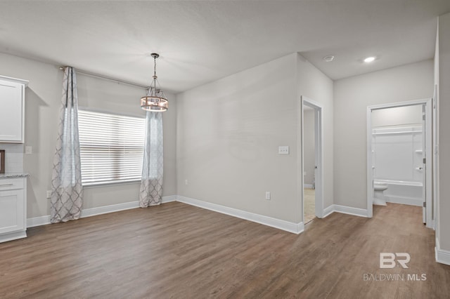 24884 Smarty Jones Cir, Daphne, AL 36526 - unfurnished dining area featuring wood finished floors, a chandelier, and recessed lighting