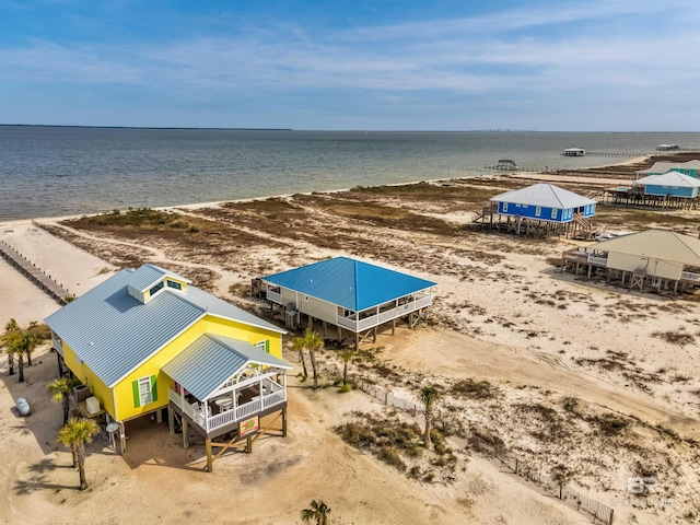 bird's eye view with a water view and a view of the beach