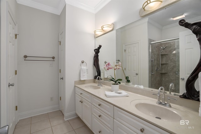 bathroom with tile patterned floors, vanity, an enclosed shower, and crown molding