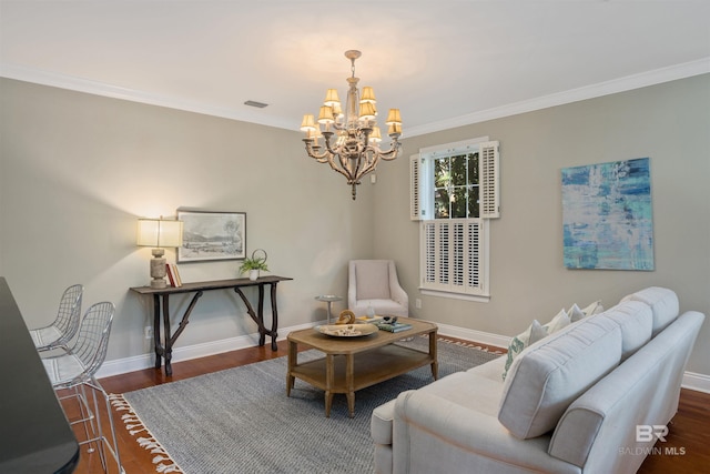 living room featuring dark hardwood / wood-style flooring, ornamental molding, and an inviting chandelier