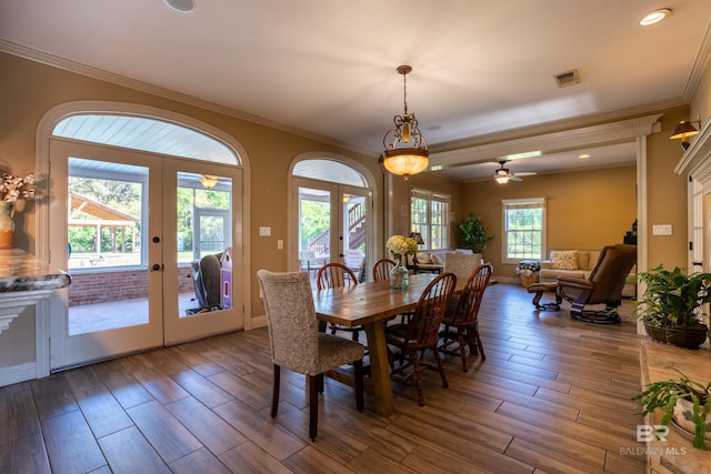 9150 County Road 91, Lillian, AL 36549 - dining area with french doors, crown molding, wood finished floors, ceiling fan, and recessed lighting