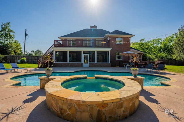 9150 County Road 91, Lillian, AL 36549 - view of swimming pool with a sunroom, a patio, and a pool with connected hot tub
